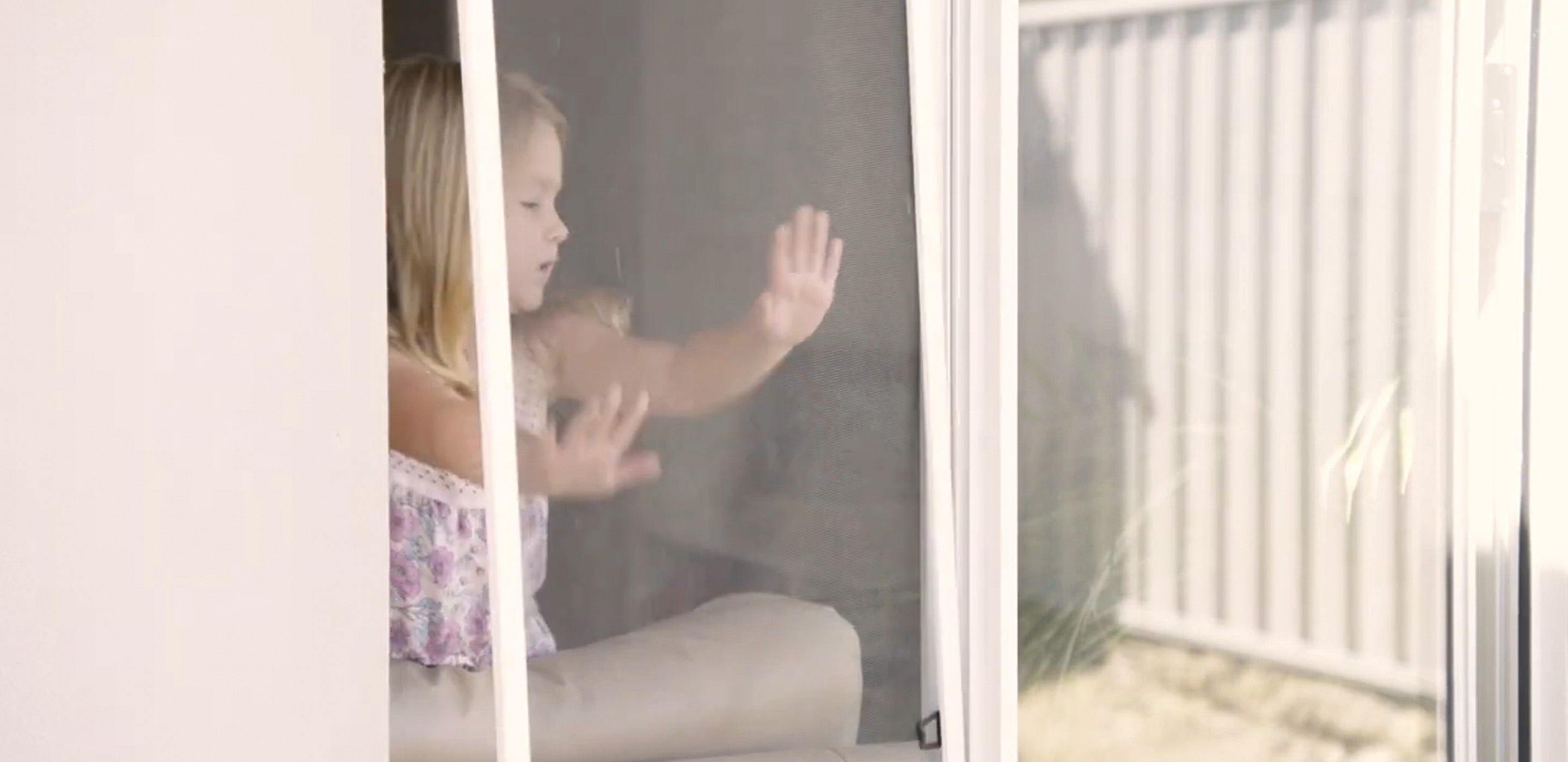 A young girl has managed to push the flyscreen off the window creating a fall risk. Replace flyscreens with Jason Security Screens to remove this risk.